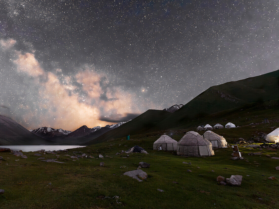 Night sky and Milky Way over yurt camp in Kol-Ukok lake landscape showcasing stars and serenity, Kyrgyzstan, Central Asia, Asia