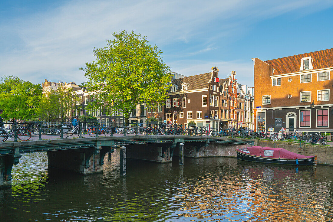 Bridge over Keizersgracht canal at sunset, Amsterdam, The Netherlands, Europe