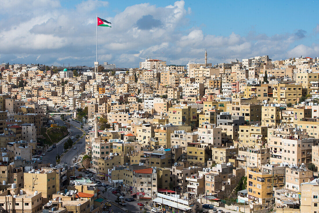 North-East district with the Jordanian flag on a 126m flagpole in front of the Raghadan Palace in the background, viewed from the top of Citadel Hill, Amman, Jordan, Middle East