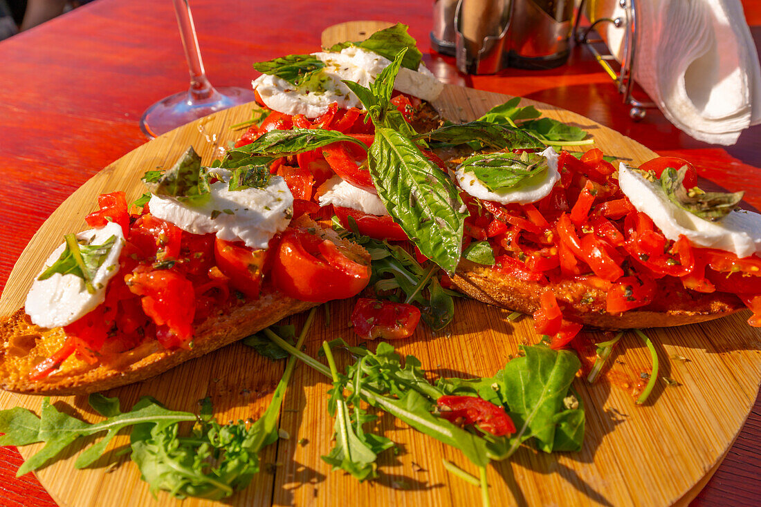 View of Italian Bruschetta at restaurant in Porto d'Ischia (Port of Ischia), Island of Ischia, Campania, Italy, Europe