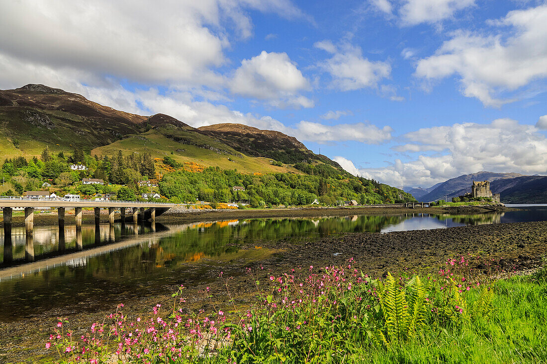 Loch Long with the A87 road bridge and 13th century Eilean Donan Castle beyond, Eilean Donan, Dornie, Kyle of Loch Alsh, West Highlands, Scotland, United Kingdom, Europe