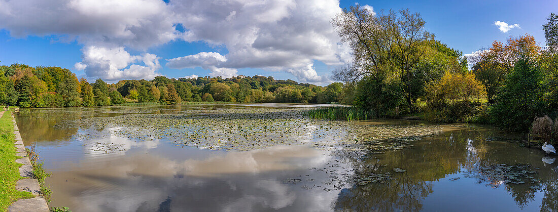 View of dramatic clouds refecting in Hardwick Ponds, Hardwick Park, Hardwick Hall, Bolsover, Derbyshire, England, United Kingdom, Europe