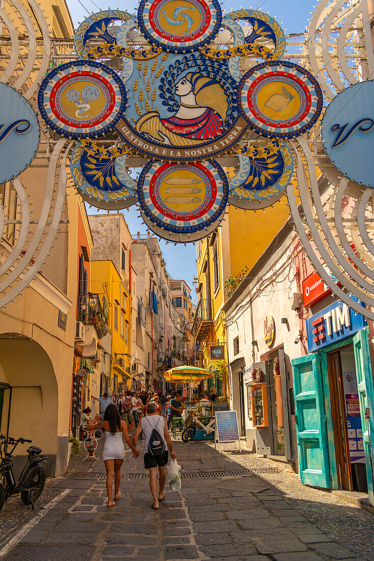 View of shops on Via Vittorio Emanuele in the fishing port, Procida, Phlegraean Islands, Gulf of Naples, Campania, Southern Italy, Italy, Europe