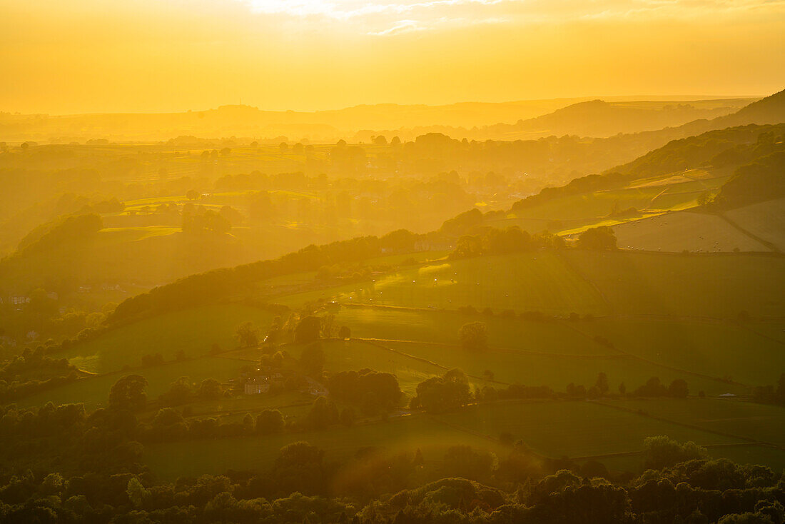 View of landscape from Curbar Edge at sunset, Peak District National Park, Baslow, Derbyshire, England, United Kingdom, Europe