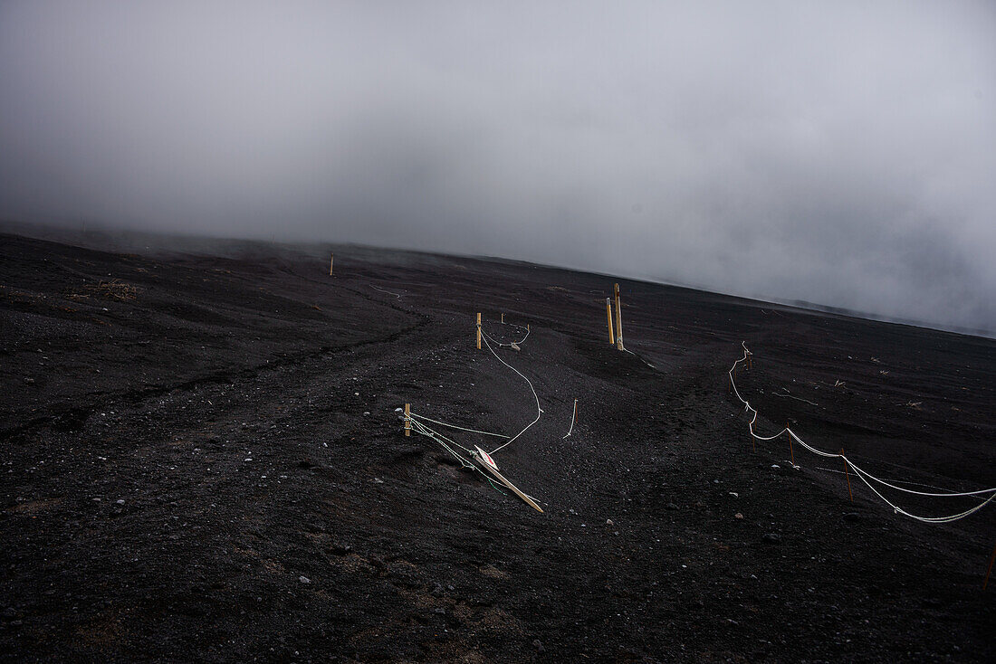 Hiking path in the ashes of Mount Fuji in a fog cloud, Honshu, Japan, Asia