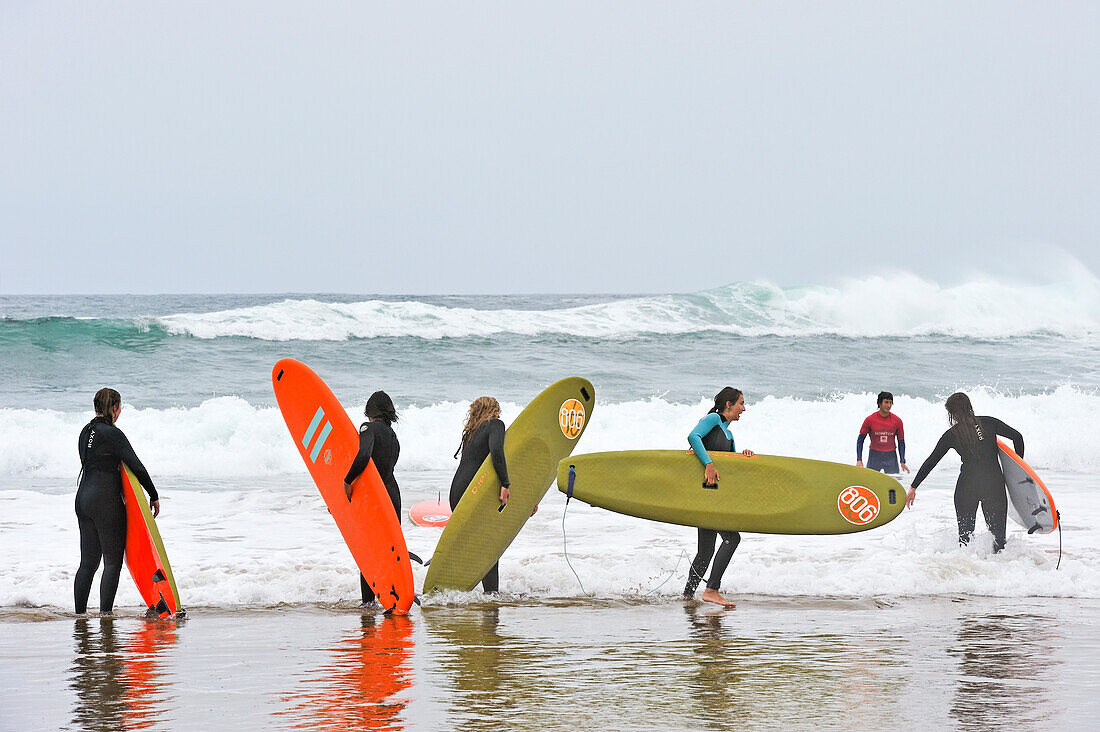 Surf class on Zurriola beach, district of Gros, San Sebastian, Bay of Biscay, province of Gipuzkoa, Basque Country, Spain, Europe