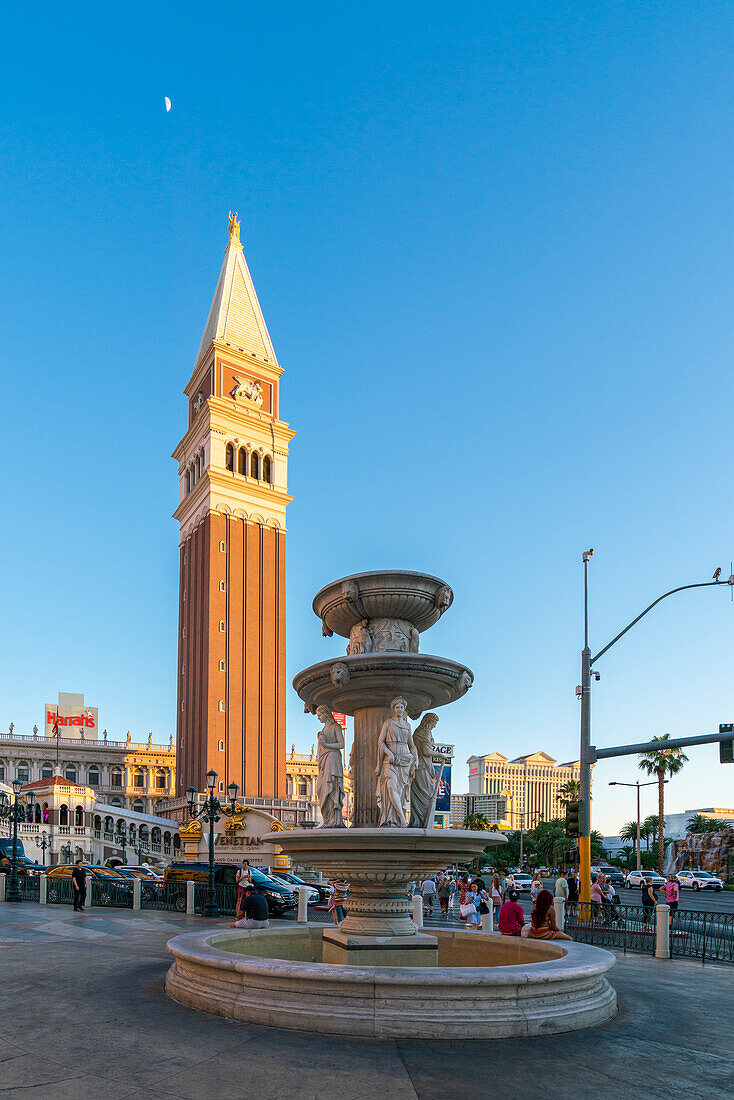 Water fountain and tower at The Venetian Las Vegas Hotel at sunset, Las Vegas Strip, Paradise, Las Vegas Boulevard, Las Vegas, Nevada, United States of America, North America