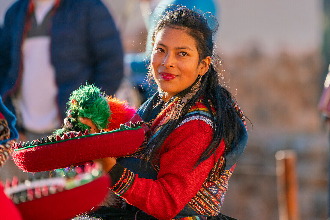 Peruvian woman in traditional dress dancing on celebration, Chinchero, Peru, South America