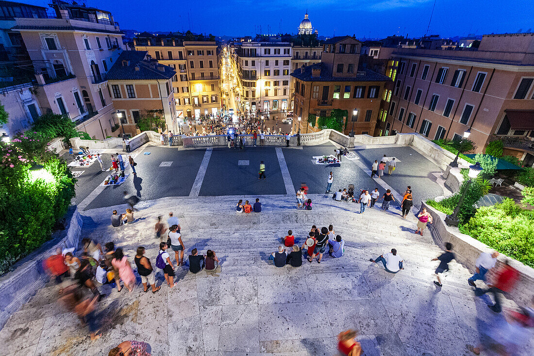 Rome, Italy, July 22 2017, The Spanish Steps come alive at dusk, filled with visitors enjoying the ambiance and beauty of Rome.