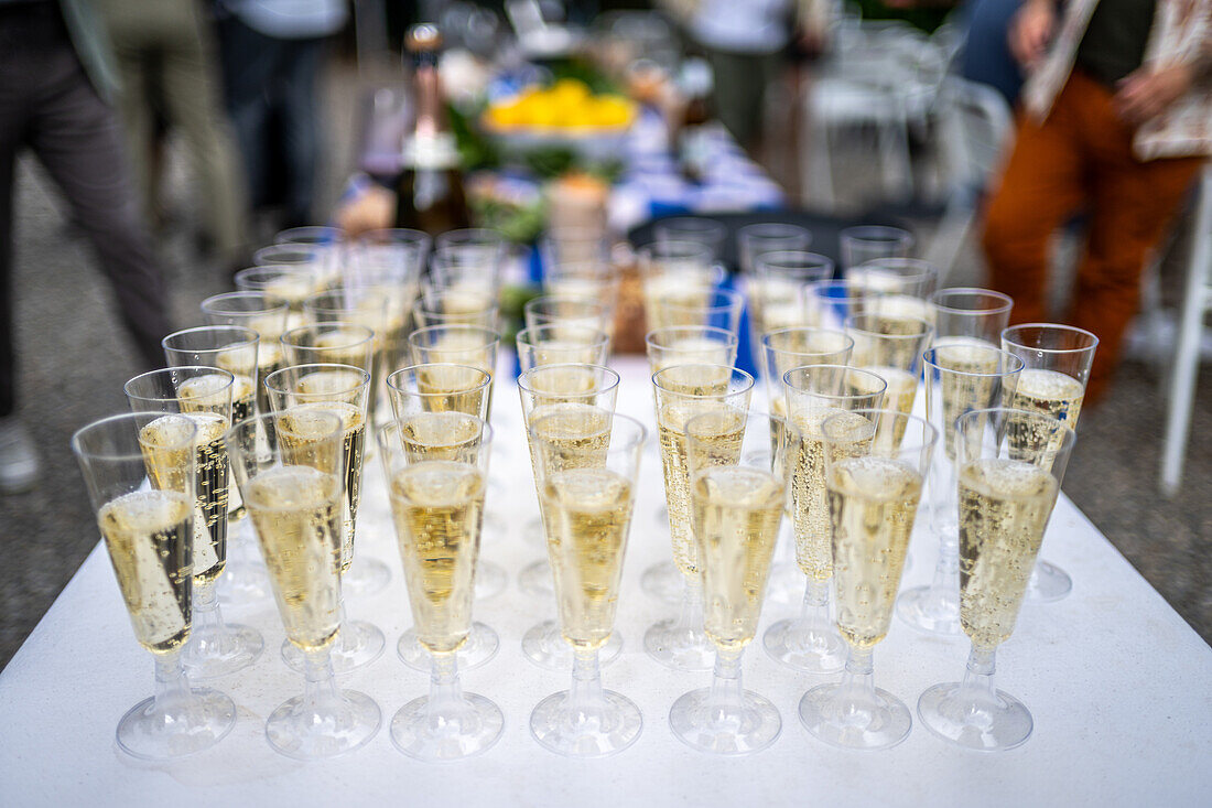 Champagne-filled glasses elegantly arranged on a table at a wedding reception in Malaga, Spain, capturing celebration and elegance in a festive atmosphere.