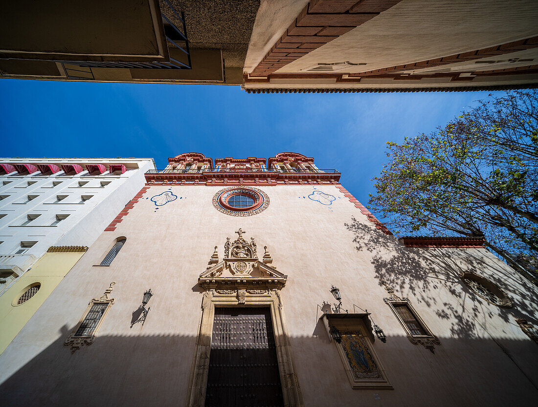 Explore the intricate details of the Baroque facade of La Magdalena Church in Seville, Spain. The image captures the architectural beauty and historical significance of this remarkable structure.