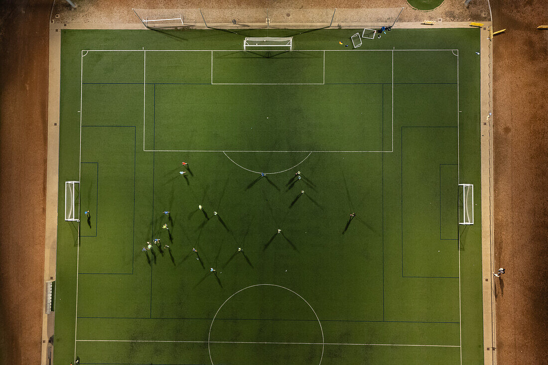 Aerial view of a training in a soccer field at night