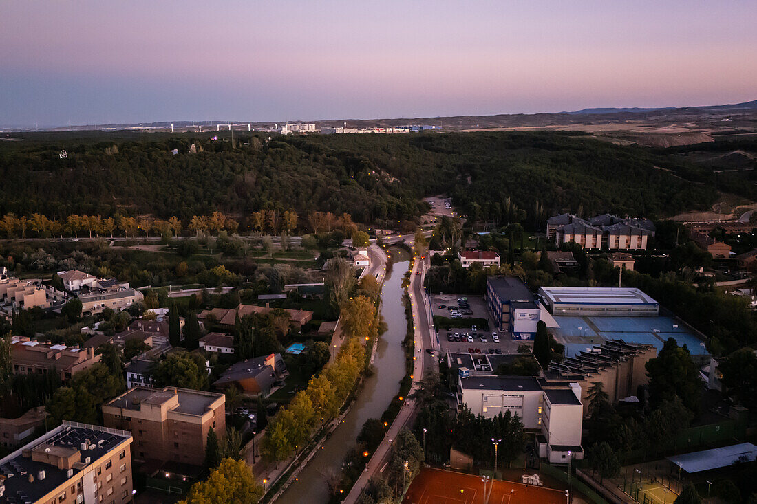 Aerial view of the Canal Imperial de Aragon in Zaragoza at sunset, Spain