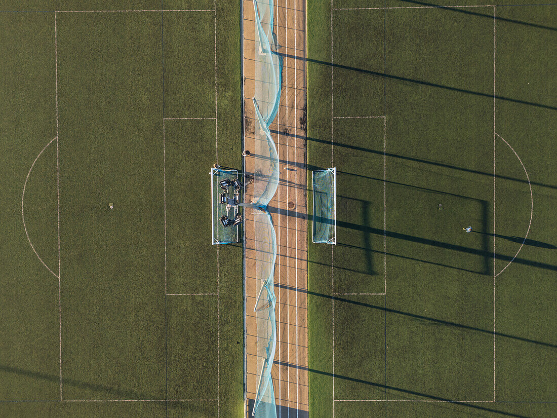 Aerial view of amateur soccer match at sunset