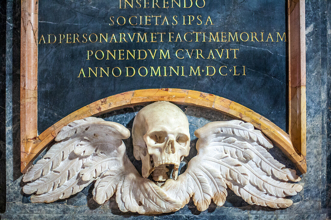 Rome, Italy, July 2017, A detailed winged skull sculpture adorns the wall of Santa Maria Sopra Minerva, captured beautifully in the heart of Rome.