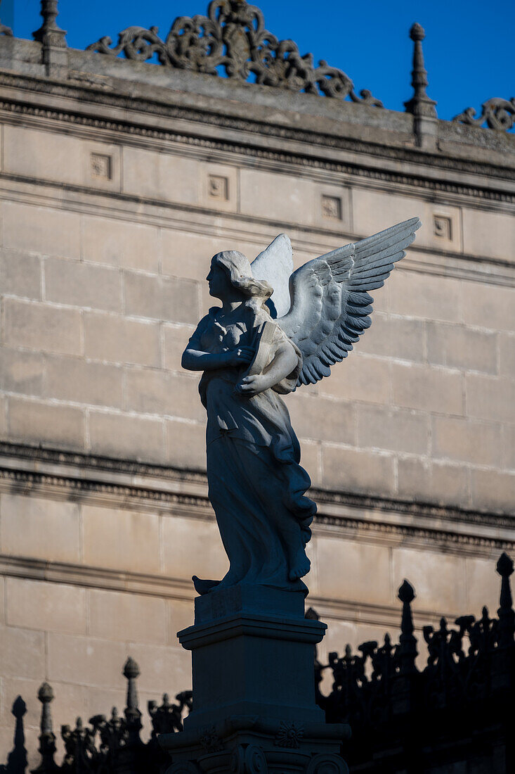 Close up of the Winged Nike statue in Plaza de America, Seville. Captures the intricate detail and artistic elegance of this historic monument against a clear sky.