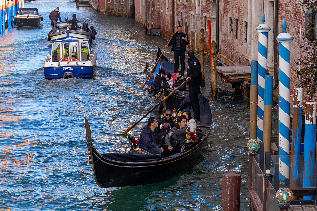 A pair of gondolas in a canal in Venice, Italy.