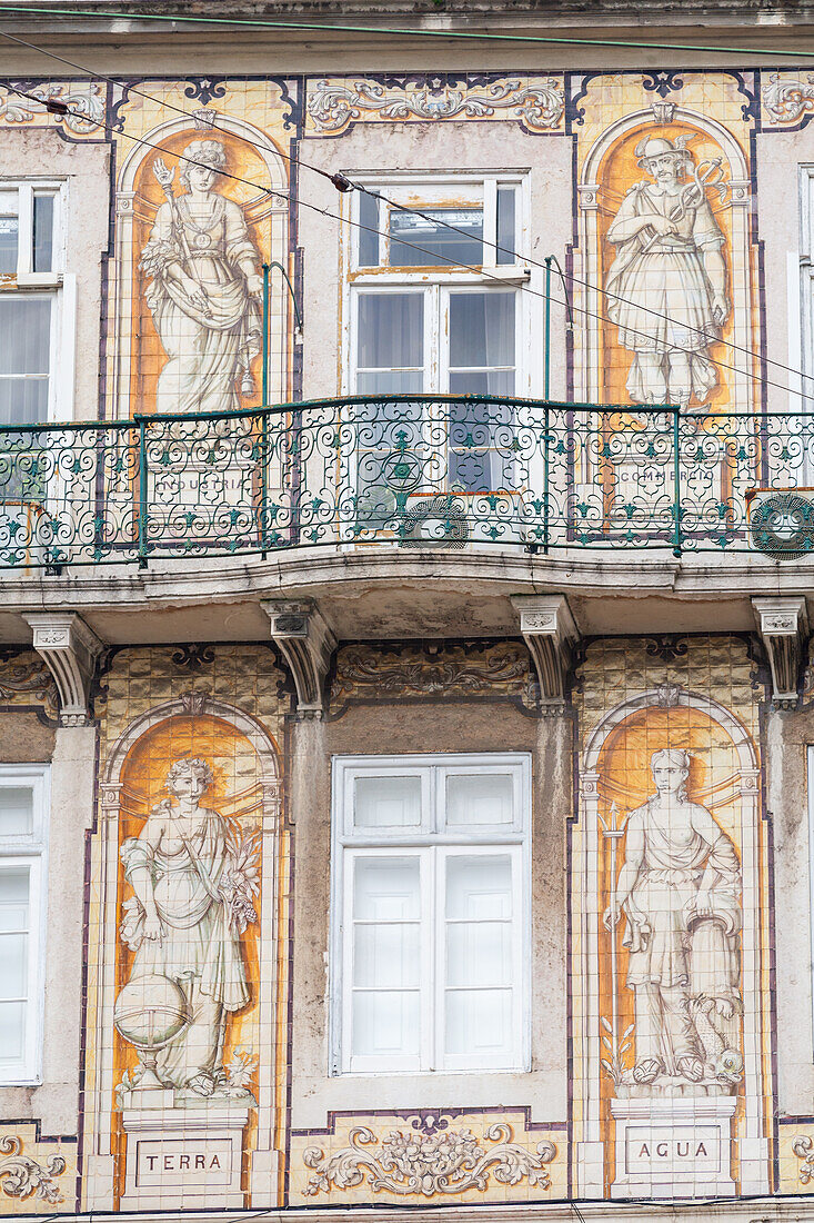 The vibrant glazed tiles and artwork of Ferreira das Tabuletas house shine in Bairro Alto, highlighting Lisbon's charm.