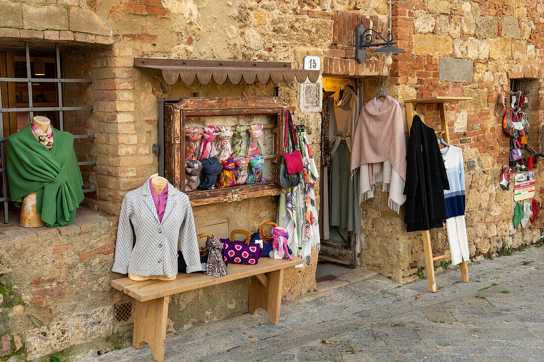 A clothing shop in the medieval walled town of Monteriggioni, Sienna Province, Italy.