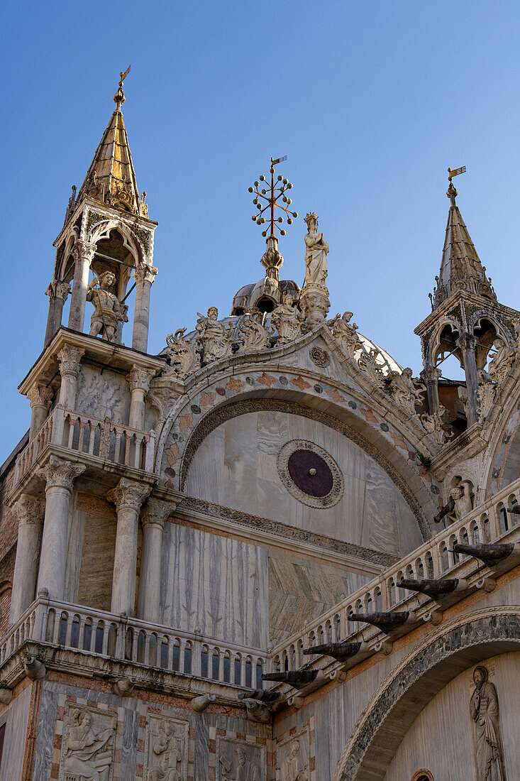 Gothic towers & statues on the north side of St. Mark's Basilica in Venice, Italy.