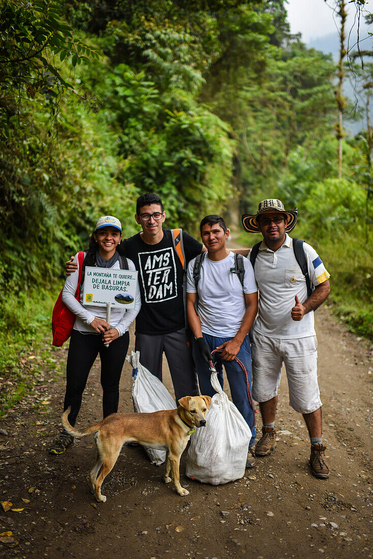 Portrait of a group of young volunteers that clean the trash left in the mountains of Combeima Canyon, Ibague, Colombia