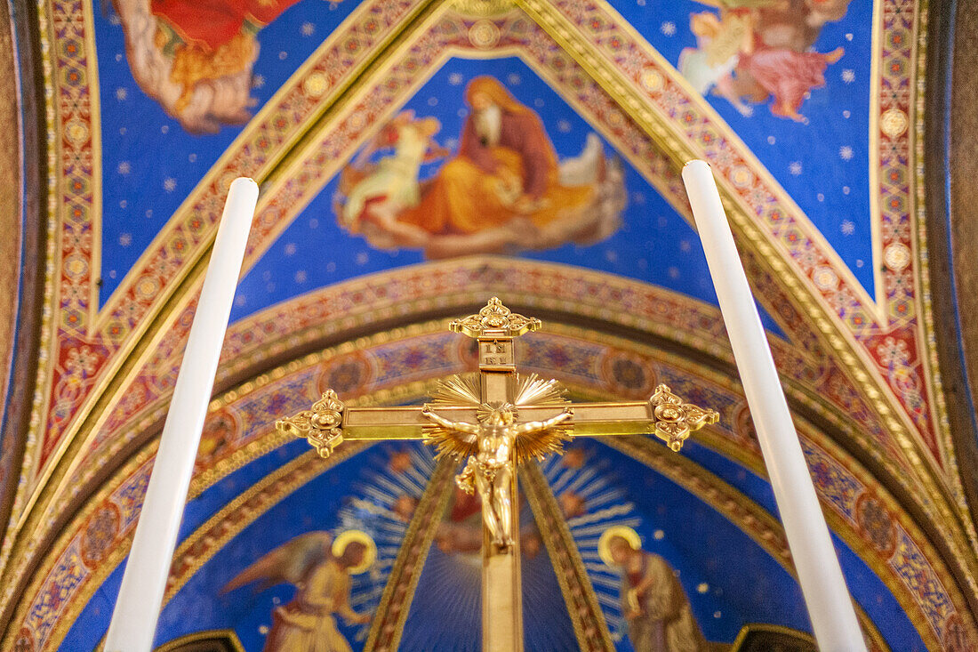 Rome, Italy, July 2017, The ornate crucifix stands prominently at the high altar within Santa Maria Sopra Minerva Basilica, showcasing intricate details.