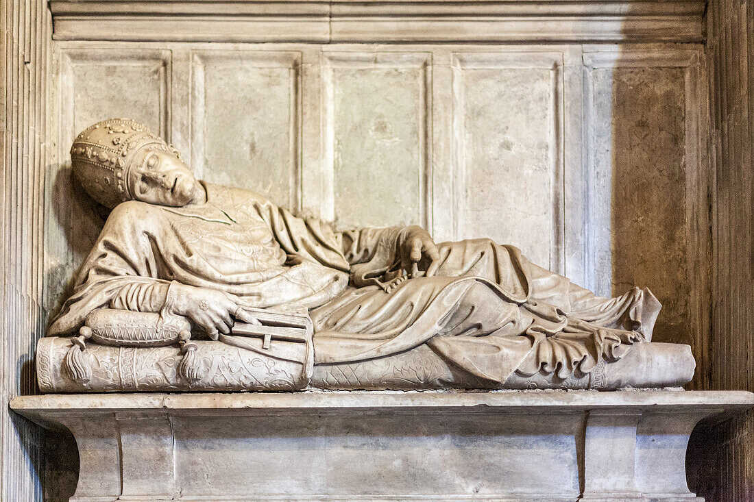 Rome, Italy, July 2017, The elaborate tomb of Pope Innocent II, sculpted by Vespignani, lies in the Santa Maria in Trastevere basilica, Rome.