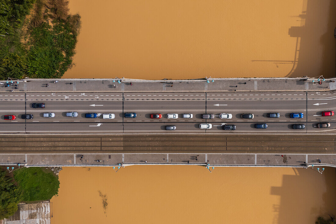 Aerial view of an abundant Ebro River passing under the Bridge after the Dana, Zaragoza, Spain