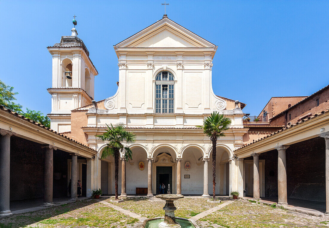 Rome, Italy, July 22 2017, Explore the serene cloister of San Clemente basilica, featuring a charming courtyard and fountain under the warm Roman sun.