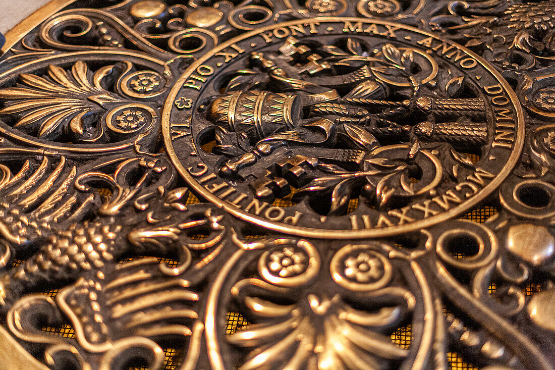 Rome, Italy, July 22 2017, The intricate coat of arms of Pope Pius XI showcases detailed craftsmanship at Saint Peter's Basilica in Vatican City.