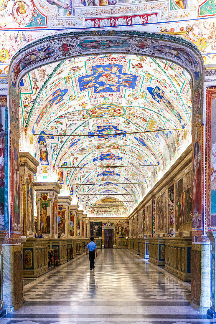 Rome, Italy, July 22 2017, Visitors explore the stunning first floor galleries of the Vatican Museums, immersed in historic art and architecture.