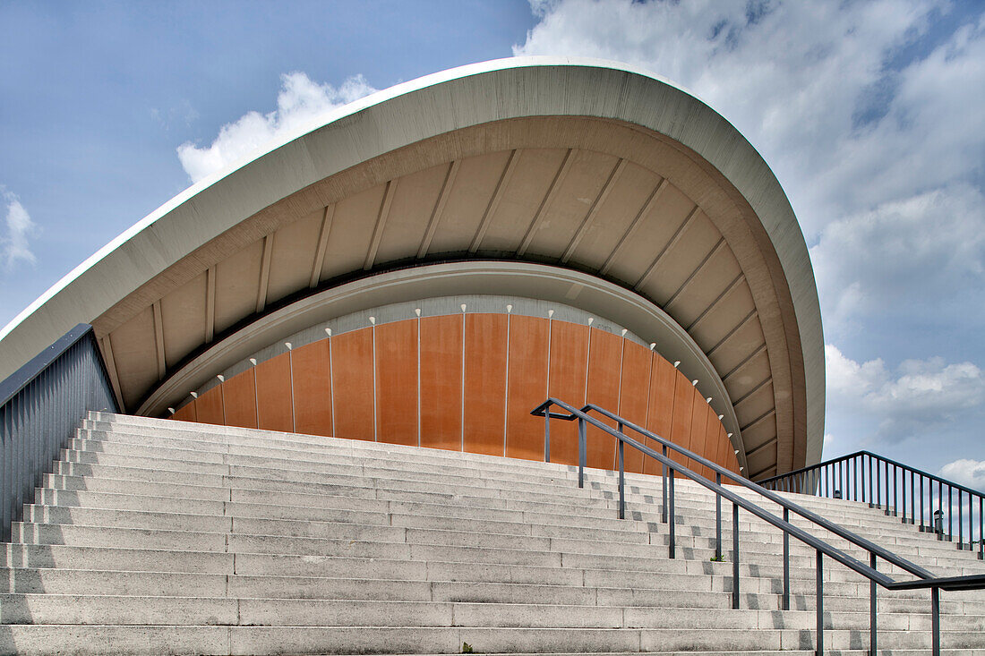 The House of World Cultures features a unique design with a prominent curved roof, located in Berlin\'s Tiergarten district.