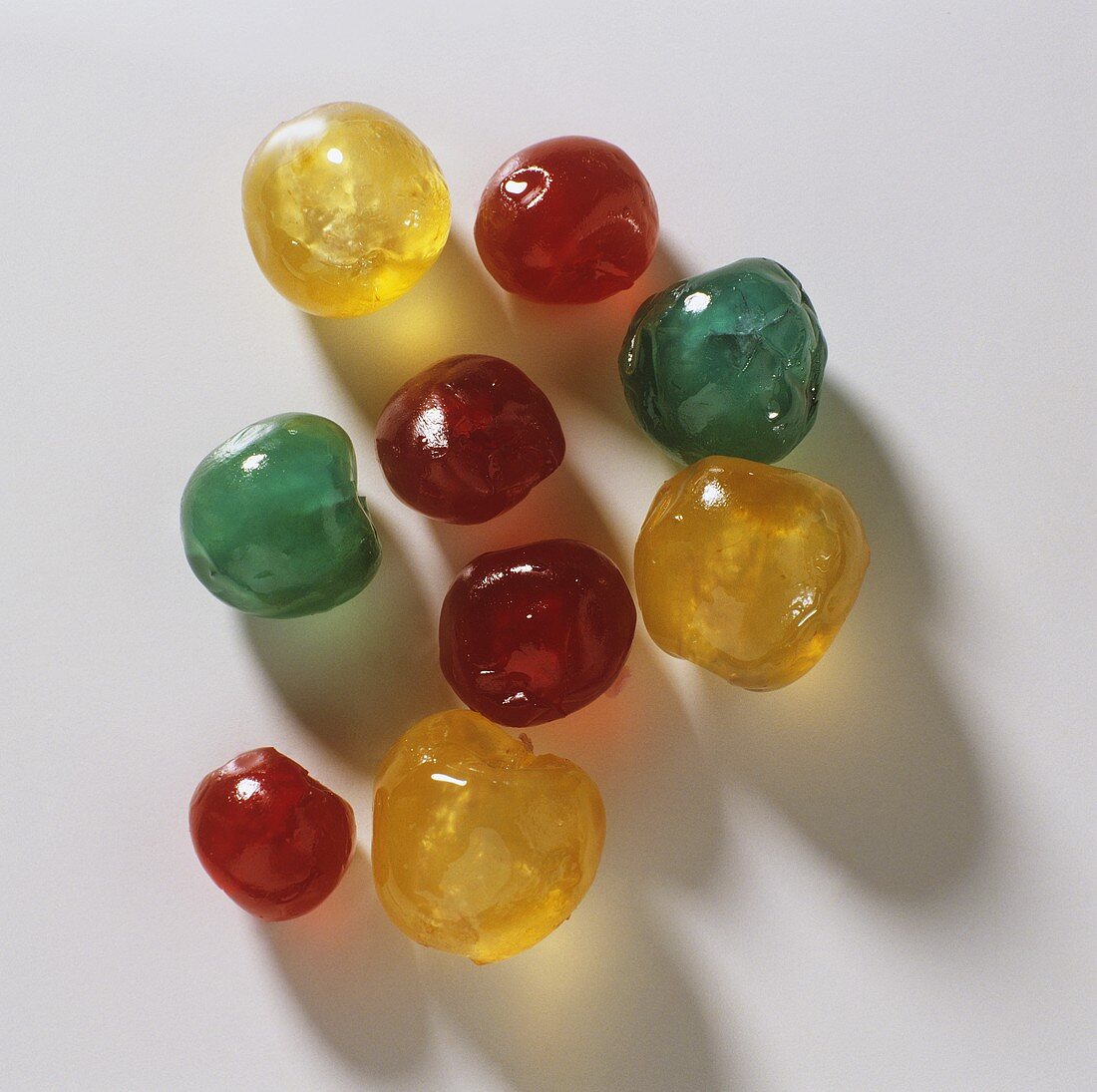Red, yellow and green candied cherries