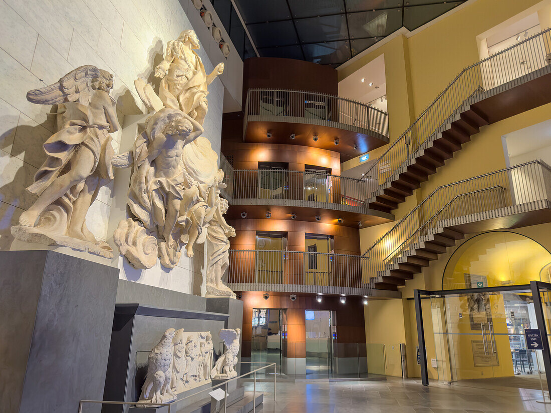 Entry hall of the Duomo Museum in Florence, Italy, with sculptures by Girolamo Ticciati on the wall.