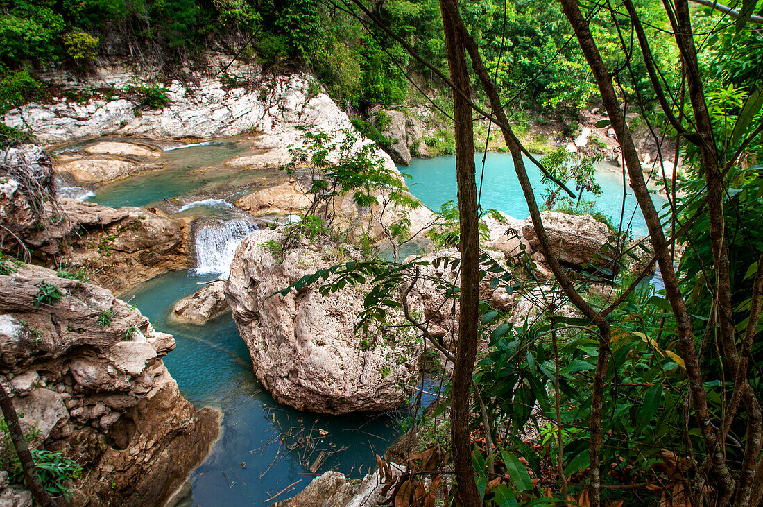 Exploring the cobalt waters of Bassin Bleu waterfall composed of bassin yes, bassin palmiste and bassin clair, Maire de Jacmel, Jacmel, Haiti