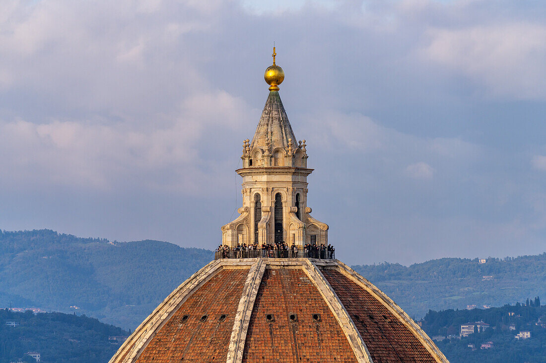 Tourists on the dome of the Duomo or Cathedral of Santa Maria del Fiore in Florence, Italy.