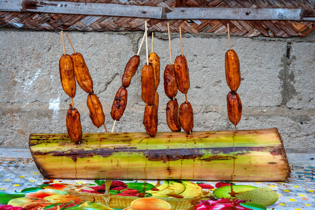 Banana cue is a popular Filipino snack or dessert often sold as street food. Sipaway Island, San Carlos City, Negros Occidental, Philippines