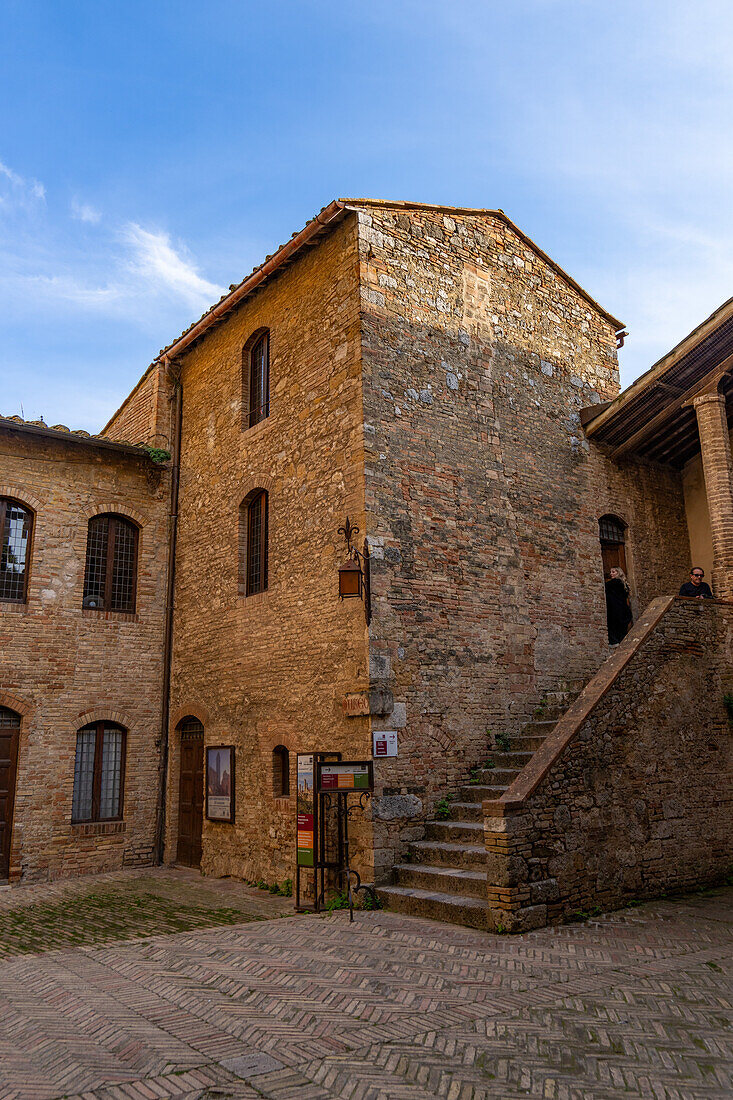 The courtyard of the Palazzo Comunale, Palazzo del Popolo or city hall in San Gimignano, Italy.