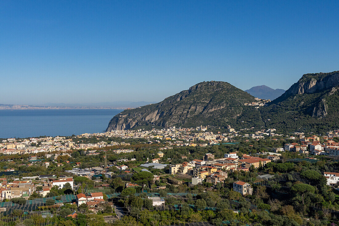 View of the commune of Piano di Sorrento on the Sorrento Peninsula in Italy. Naples Metropolitan Area is across the Bay of Naples.