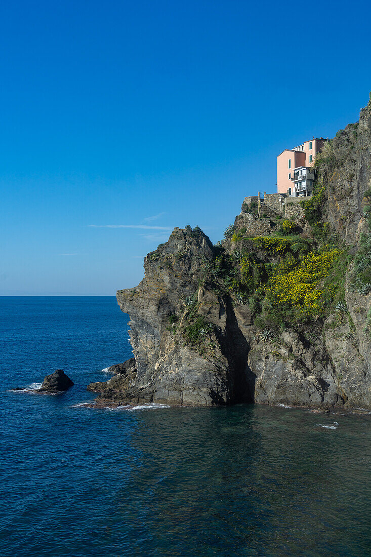 A small hotel on the cliff above the Ligurian Sea at the Cinque Terre town of Manarola, Italy.