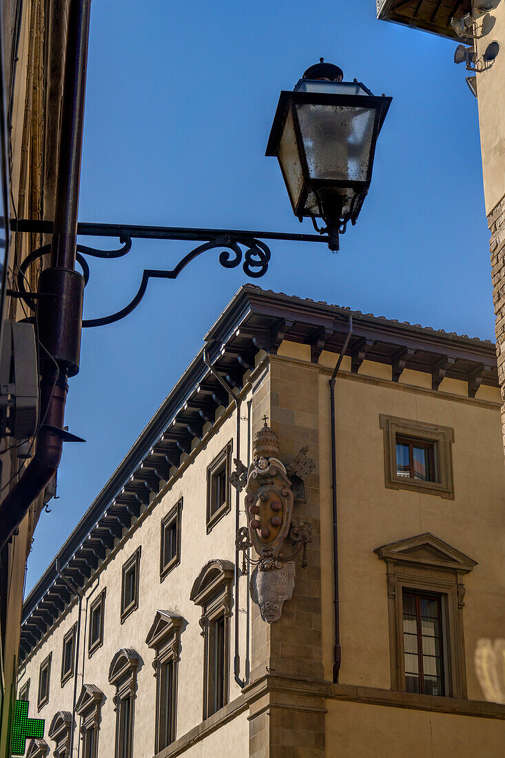 The Medici coat of arms on the Archbishop's Palace on the Piazza San Giovanni in Florence, Italy.