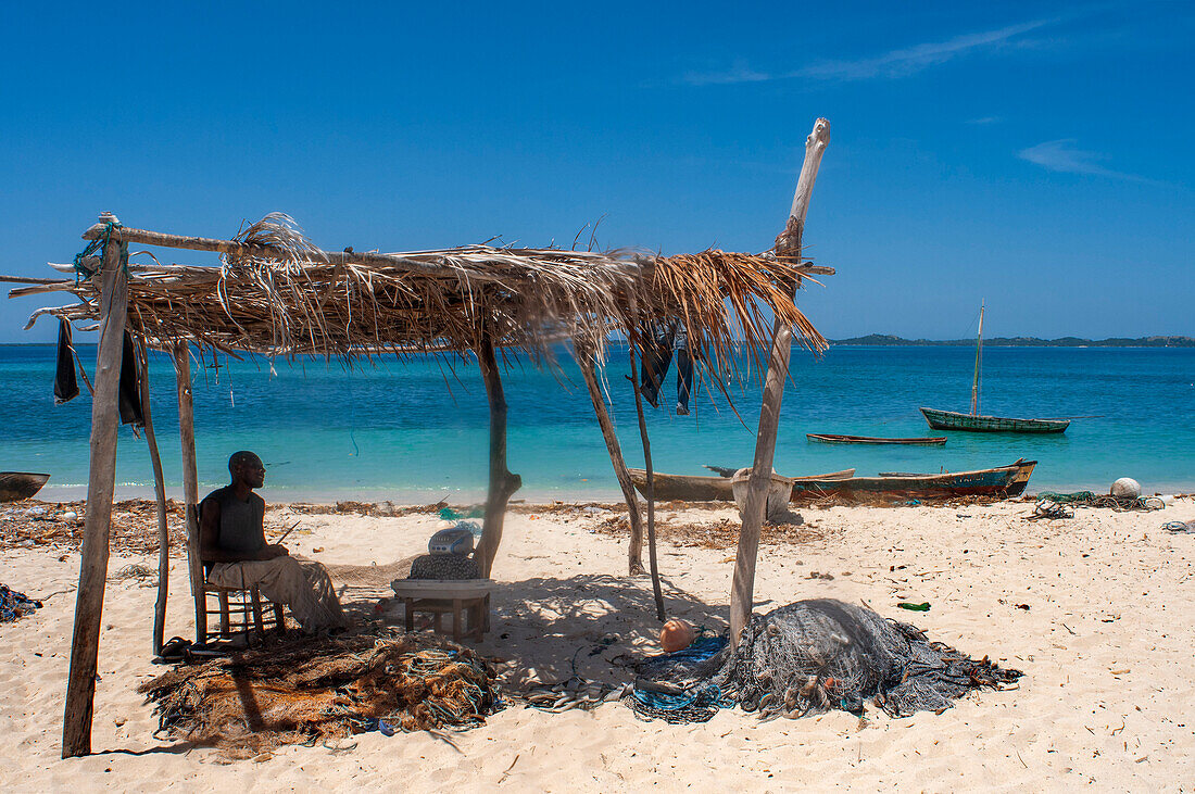 Fisherman fixing the nets in Cayes-à-L’eau, a fishermen islet located northeast of Caye Grand Gosie, Île-à-Vache, Sud Province, Haiti