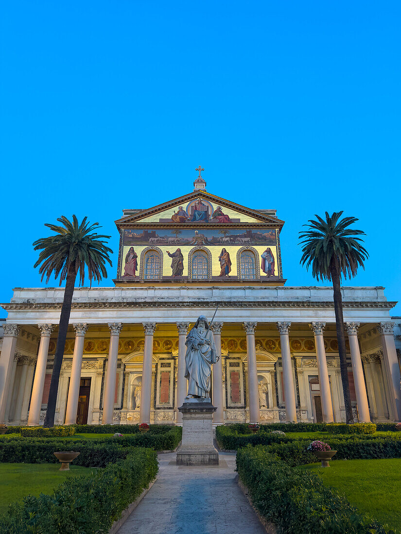 The statue of St. Paul and facade of the Basilica of St. Paul Outside the Walls, Rome, Italy.