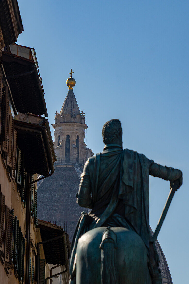 The statue of Grand Duke Fernando de Medici facing the dome of the Medici Chapel in Florence, Italy.