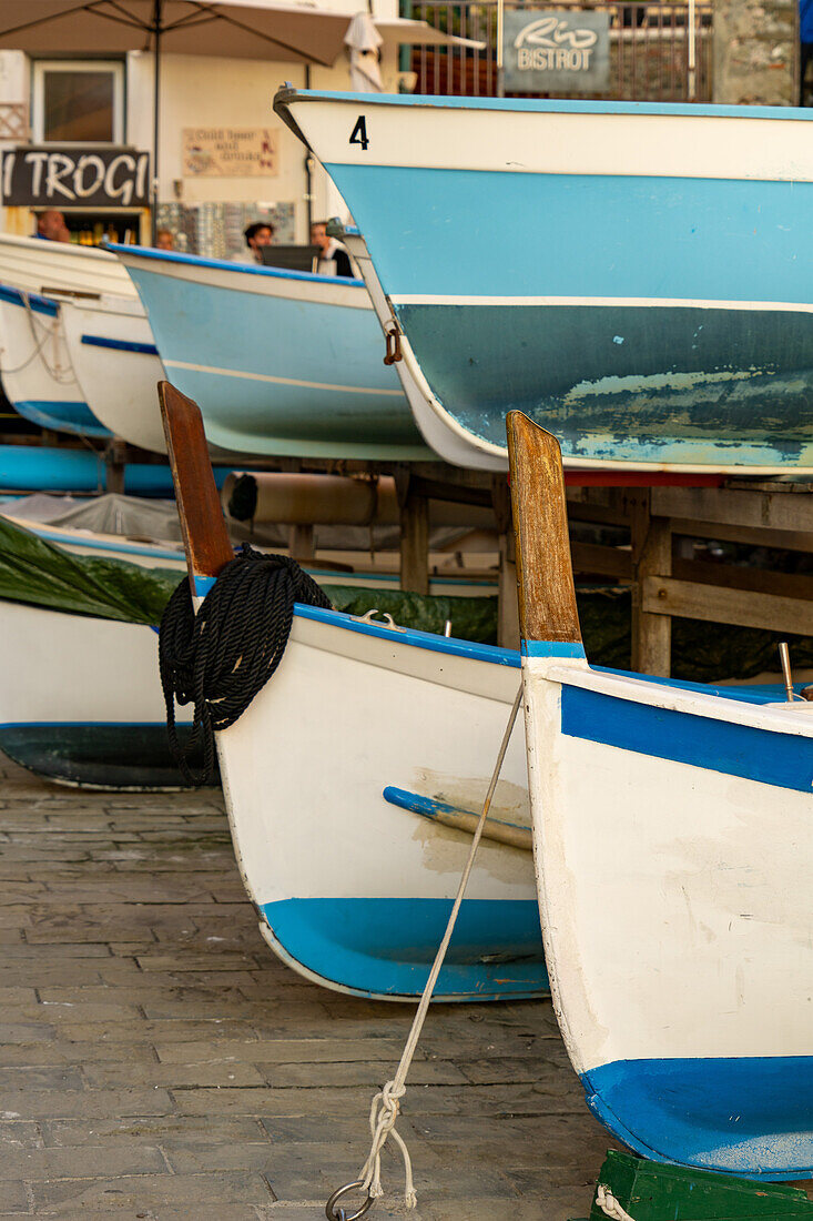 Boats out of the water by the harbor in Riomaggiore, Cinque Terre, Italy.