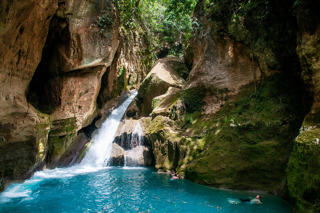 Exploring the cobalt waters of Bassin Bleu waterfall composed of bassin yes, bassin palmiste and bassin clair, Maire de Jacmel, Jacmel, Haiti