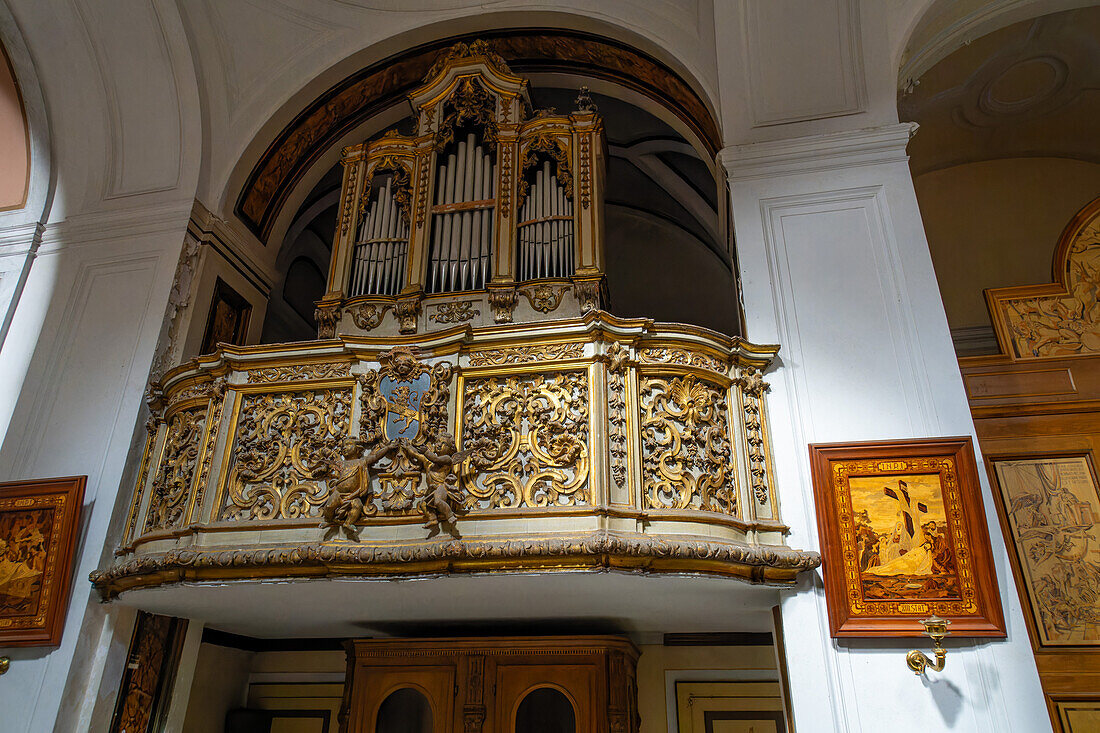 Ornate 18th Century organ in a side chapel in the Cathedral of Saints Philip and James in Sorrento, Italy.