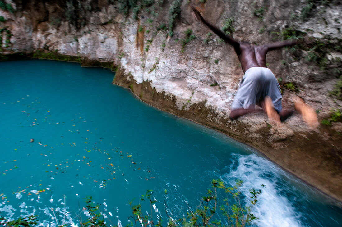 Exploring the cobalt waters of Bassin Bleu waterfall composed of bassin yes, bassin palmiste and bassin clair, Maire de Jacmel, Jacmel, Haiti