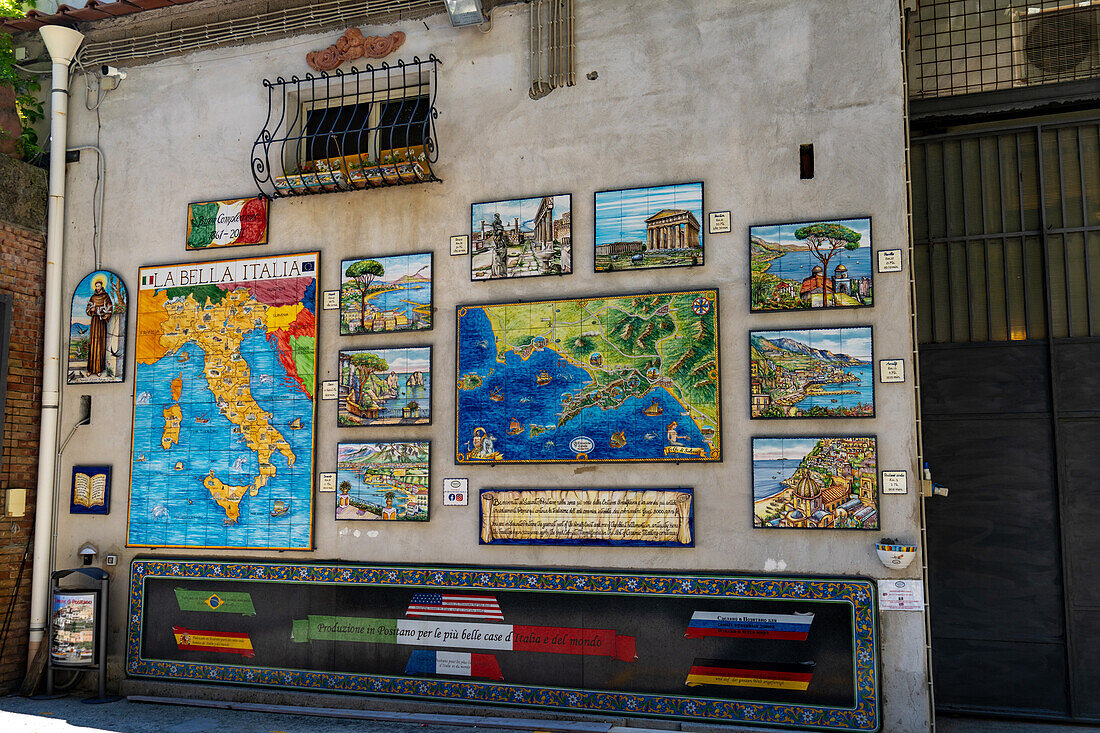 Ceramic tile maps and pictures at a ceramic shop on the Amalfi Coast of Italy.