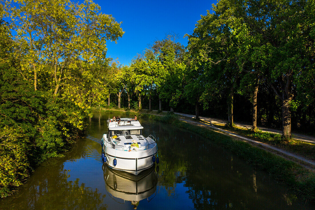 Aerial view of a nice landscape in the Canal du Midi near L'écluse de Marseillette South of France southern waterway waterways holidaymakers queue for a boat trip on the river, France, Europe